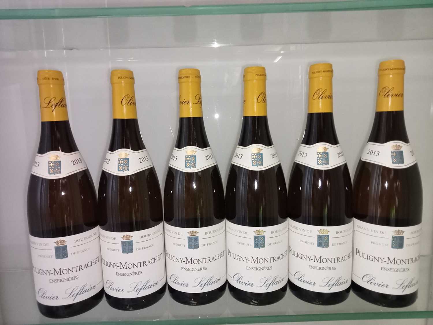 Lot 76 - 12 bottles 2013 Puligny-Montrachet Enseigneres O Leflaive