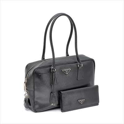 Lot 59 - Prada - a black Saffiano leather handbag and purse.