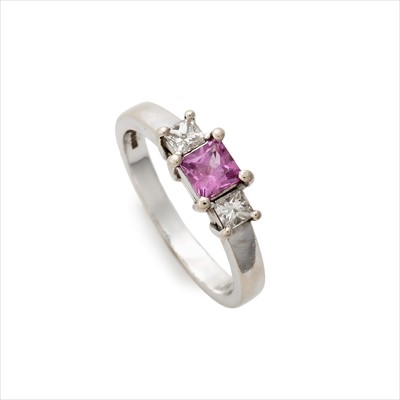 Lot 32 - An 18ct gold pink sapphire and diamond three-stone ring.