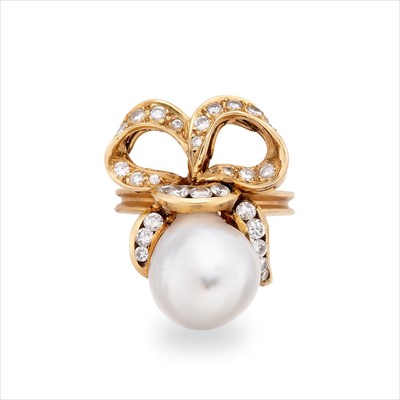 Lot 64 - A pearl and diamond dress ring.