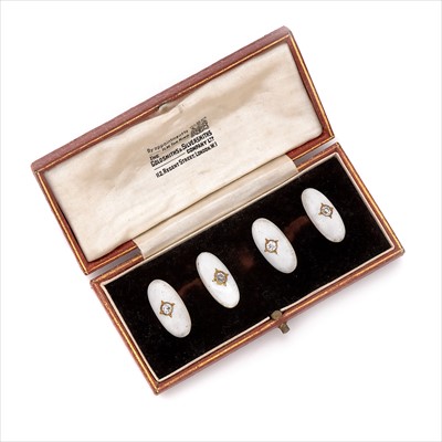 Lot 10 - A pair of early 20th century white enamel and diamond cufflinks.