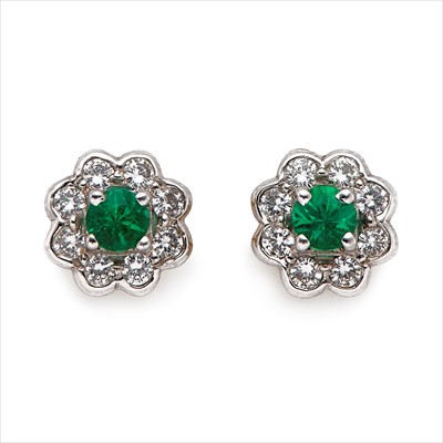 Lot 77 - A pair of 18ct gold emerald and diamond stud earrings.
