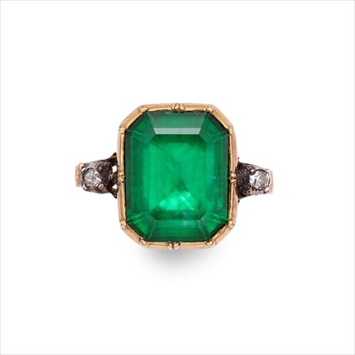 Lot 78 - A foil-back emerald and diamond ring.