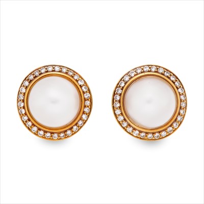 Lot 55 - Cartier - a pair of 18ct gold mabe pearl and diamond earrings.