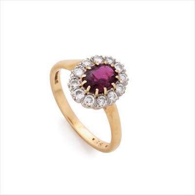 Lot 49 - A ruby and diamond cluster ring.